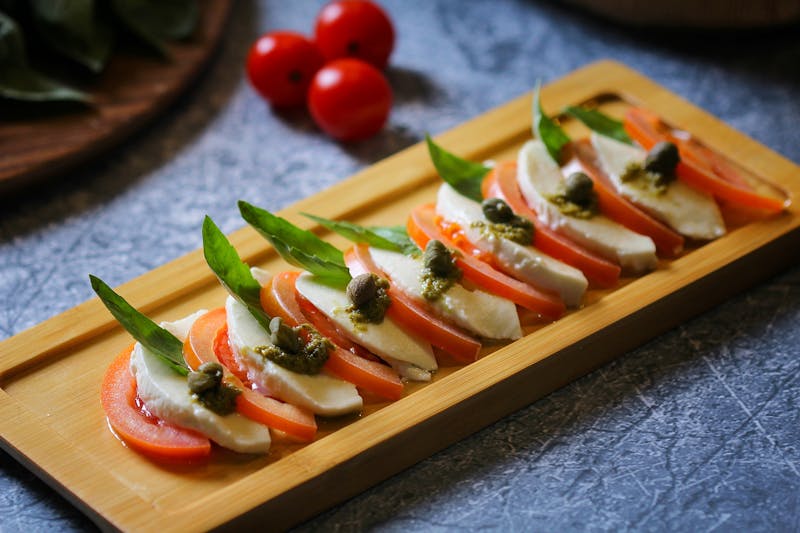 Insalata Caprese with buffalo mozzarella and heritage tomatoes at Pizzana